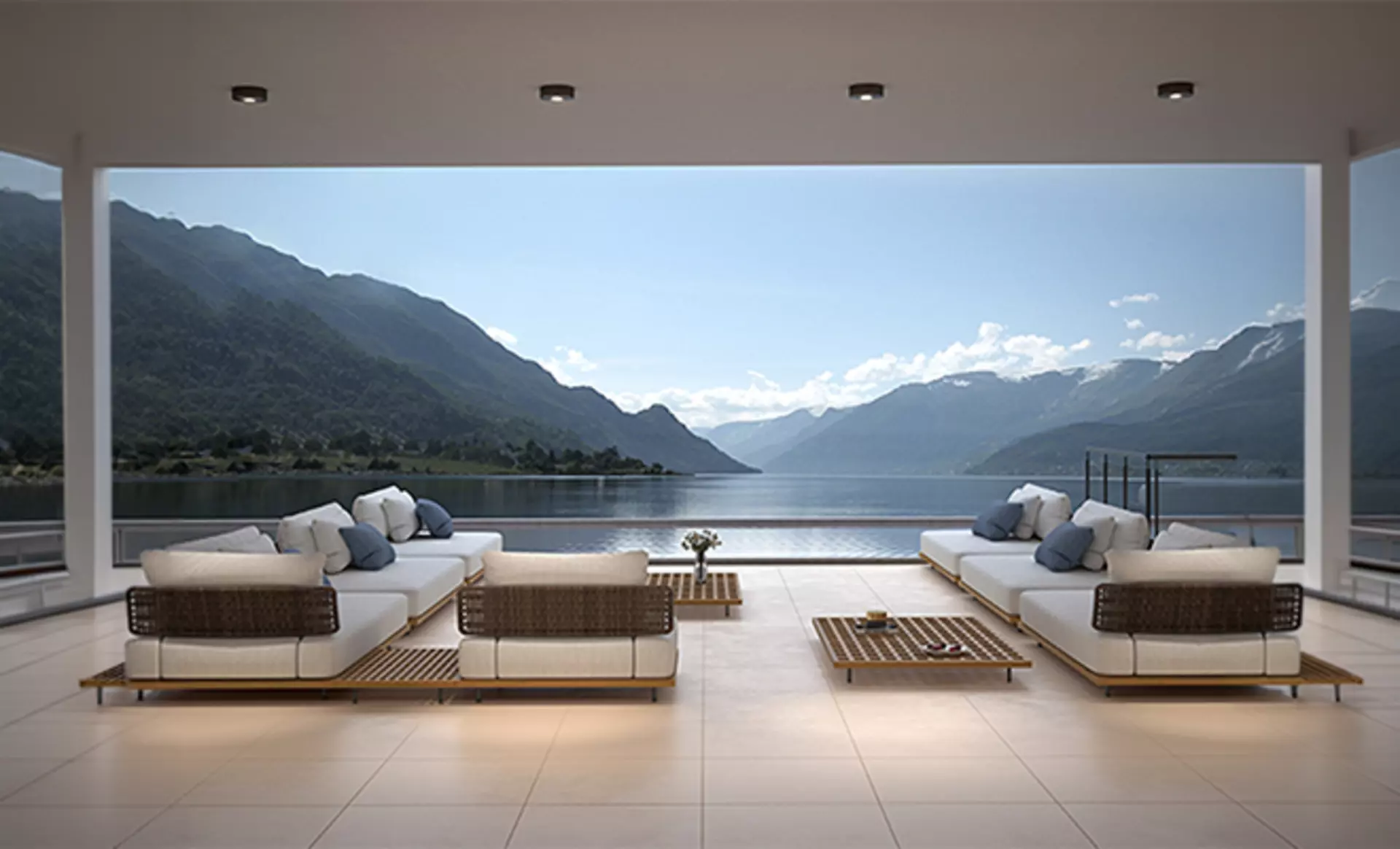 Außendecken-Spotleuchten von CMD leuchten eine offene luxuriöse Terrasse mit Pool und Bergen im Hintergrund aus.