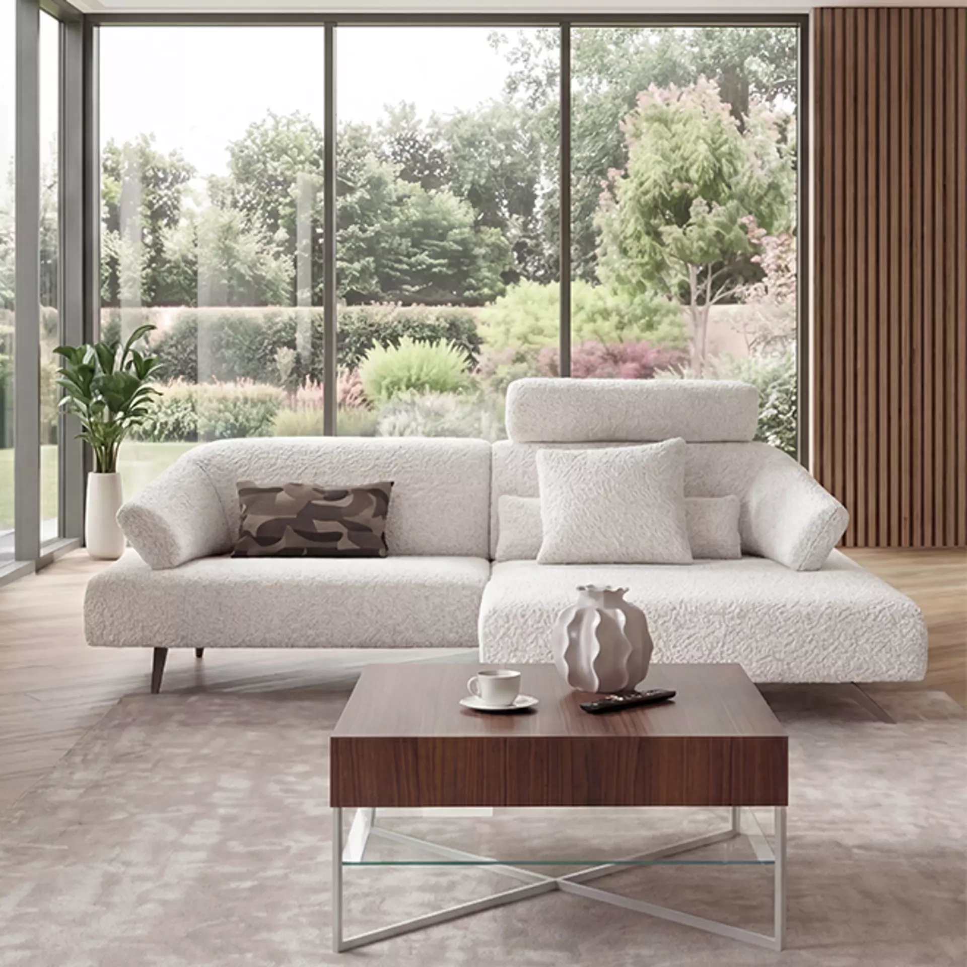 Die Wohnlandschaft Nave in weißem Stoff bezug mit einem modernen couchtisch aus massivem Holz