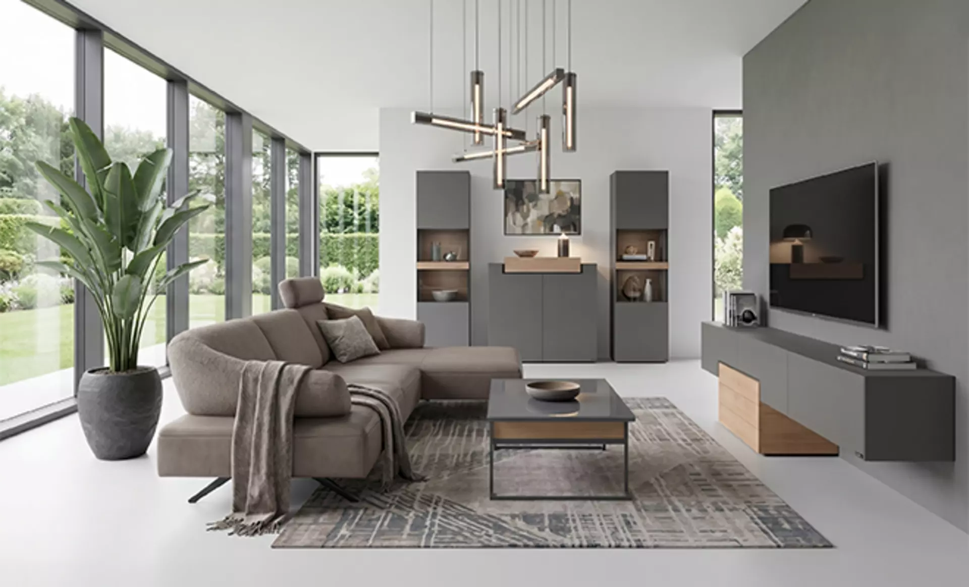 Die Mediamöbel der Latus Serie von Hülsta in einem Wohnzimmer mit Nave Sofa in braunem Stoffbezug