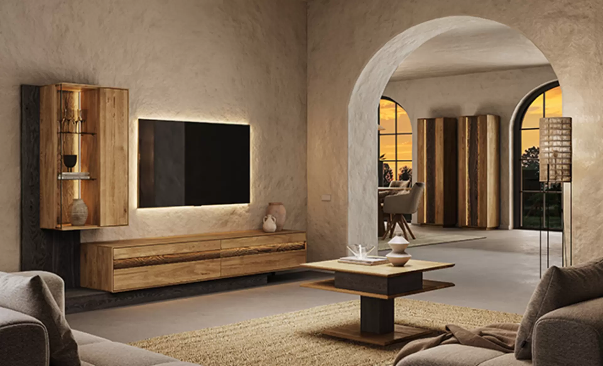 Eine Wohnwand von Wimmer aus der Caliora Serie aus massivem Holz mit schwebender Optik und indirekter Beleuchtung